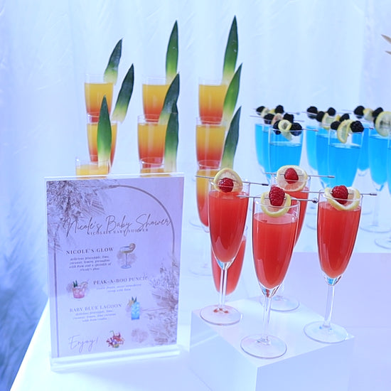 a landscape scan of colourful cocktail/mocktail display for a baby shower