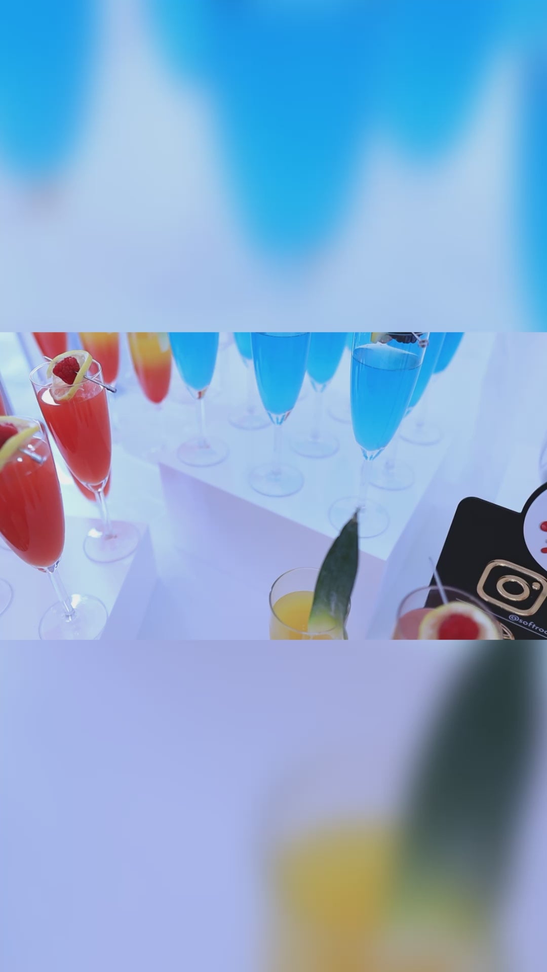 a selection of colourful cocktails and guest helping themselves